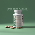 Brazen Moringa Pure supplement bottle with capsules on a green background