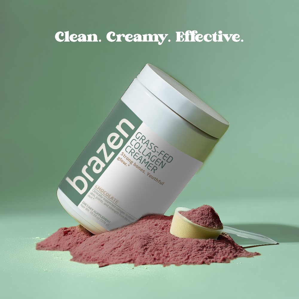 Container of brazen grass fed collagen creamer with chocolate powder and a scoop on a green background.