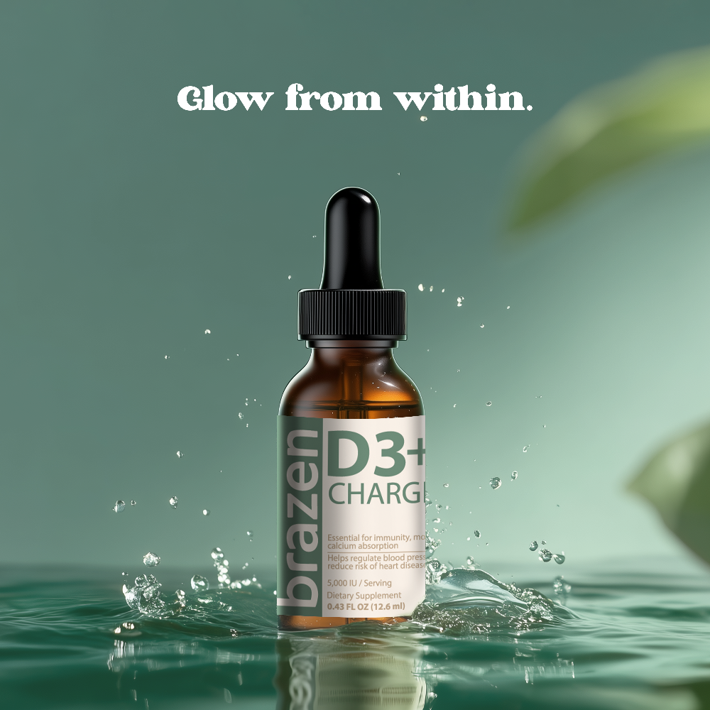 Brazen D3+ Charge dropper bottle on a green background with water and leaves.